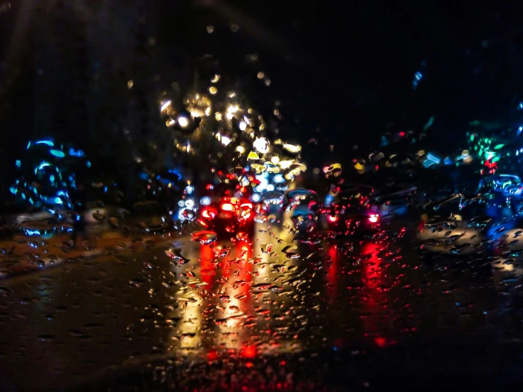 the traffic is stopped on a rainy night