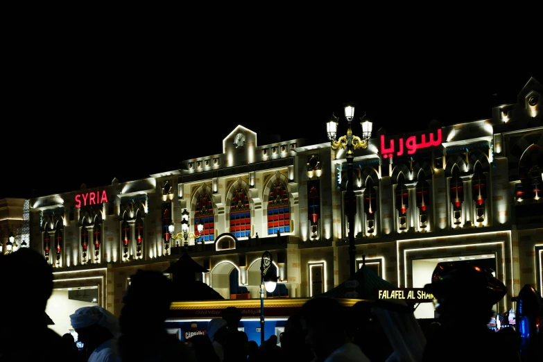 a large building with lights all over it