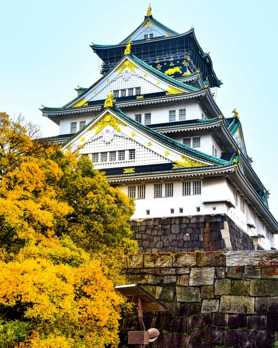 an elaborate looking building on top of a hill