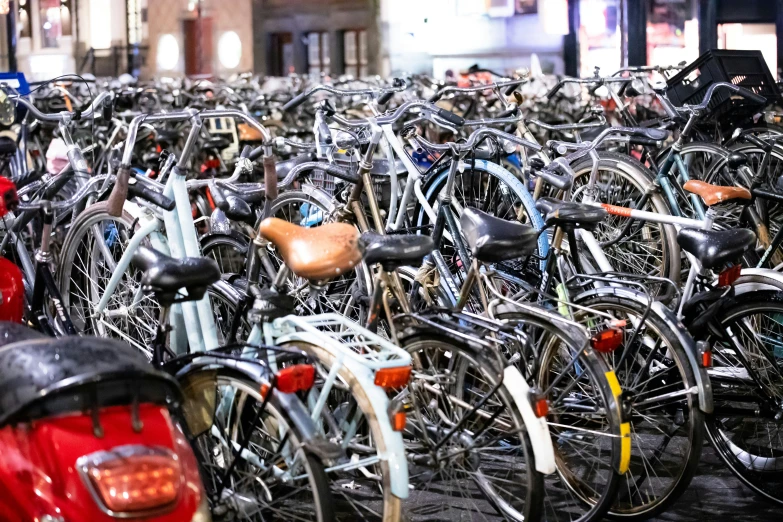 a lot of bikes that are parked next to each other