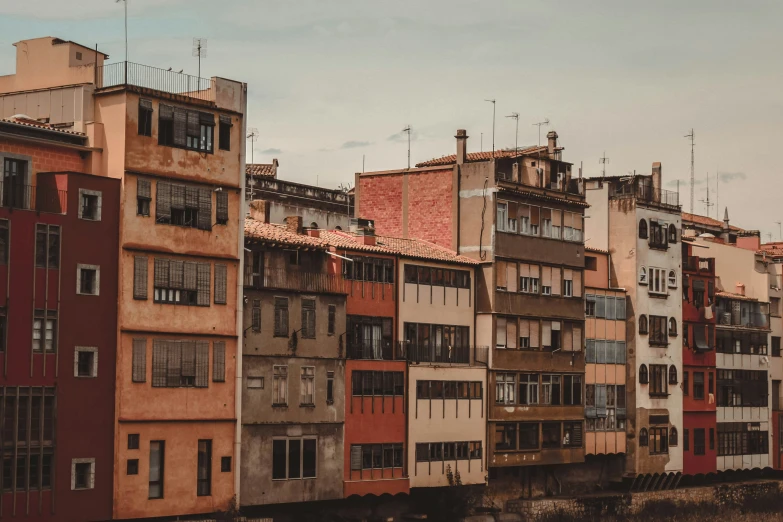 several buildings that are painted red and grey