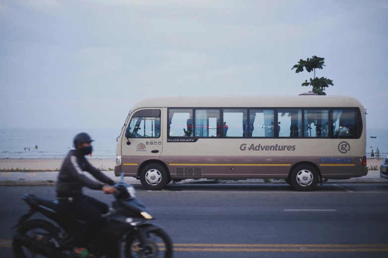 a person is riding a motor bike down the road