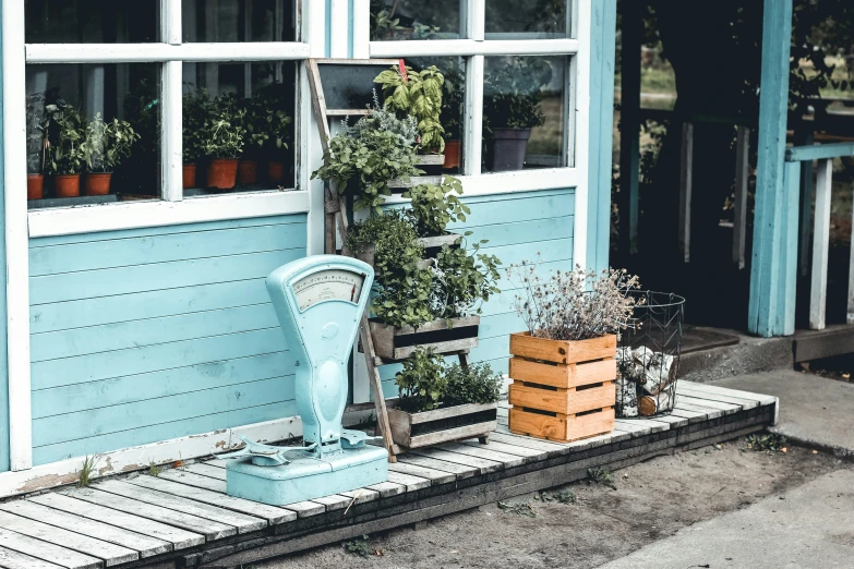 an old blue painted chair on a porch