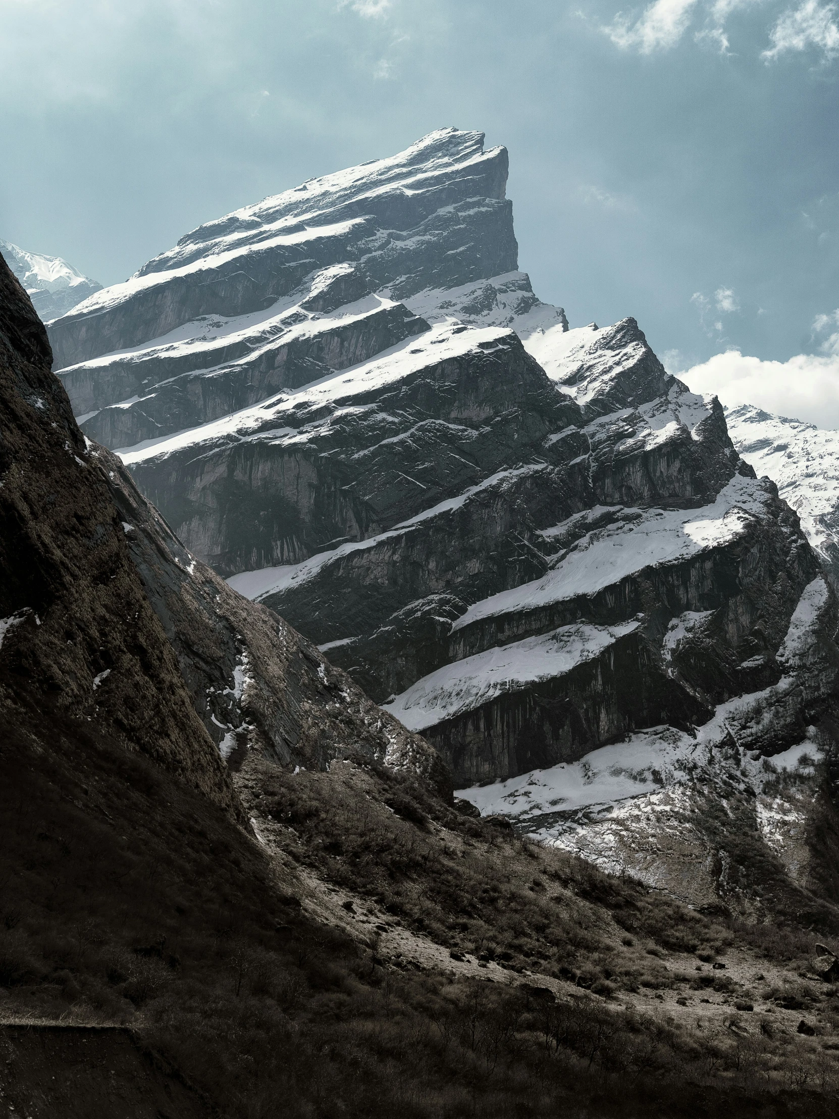 snowy mountains are shown in this black and white po