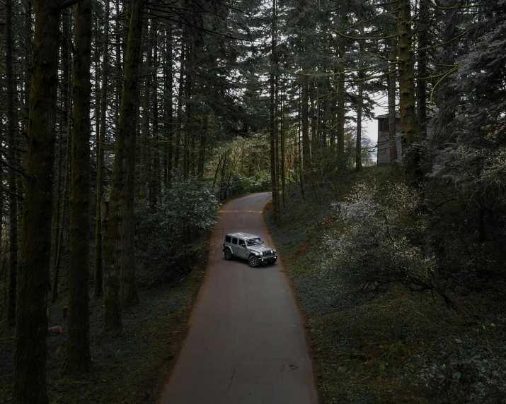 a van is parked at the end of a narrow road