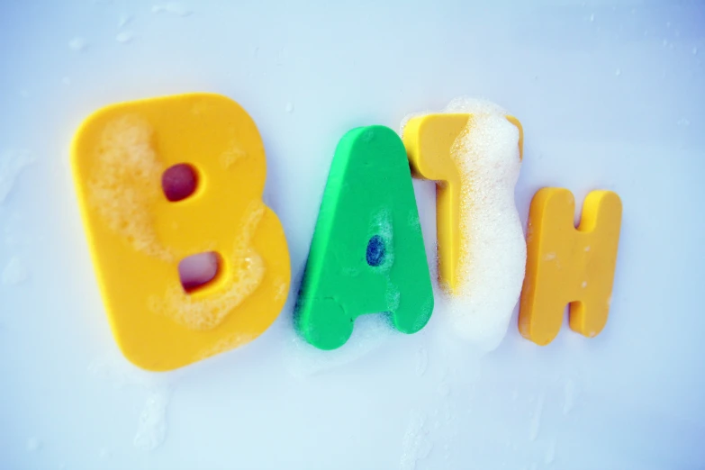 a baby's name spelled with plastic letters in the snow