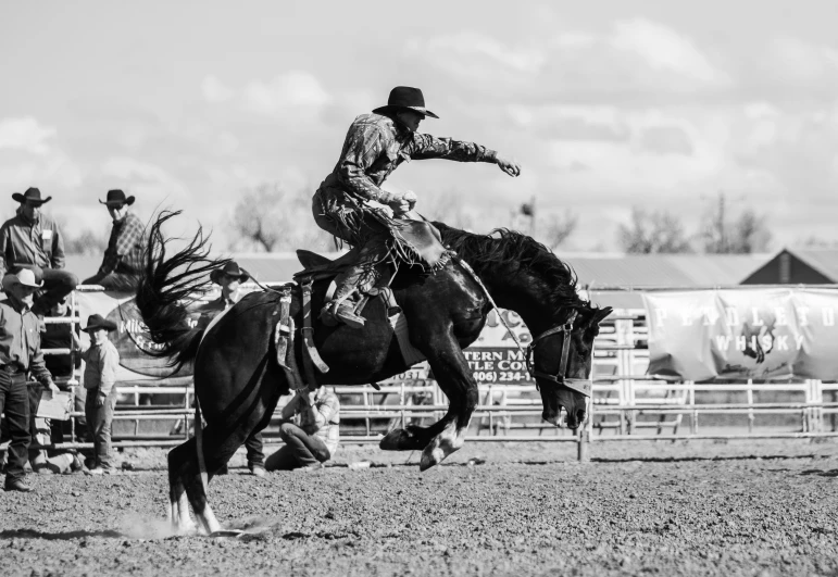 a man on top of a horse near some other men