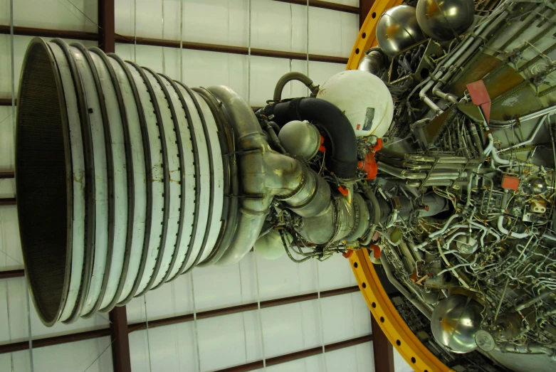 the inside of a huge engine with metal gears