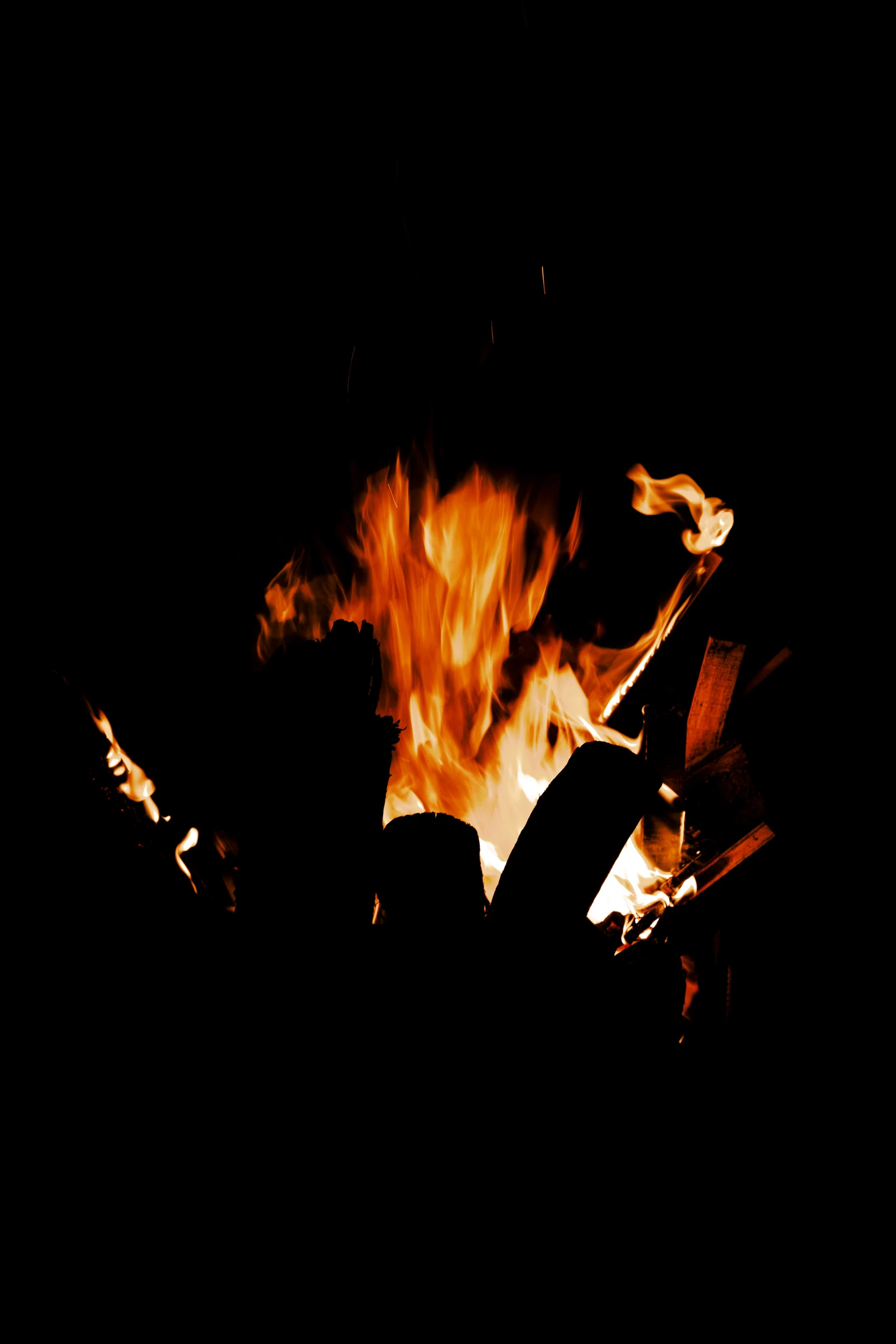 a fire is shown burning in a black background