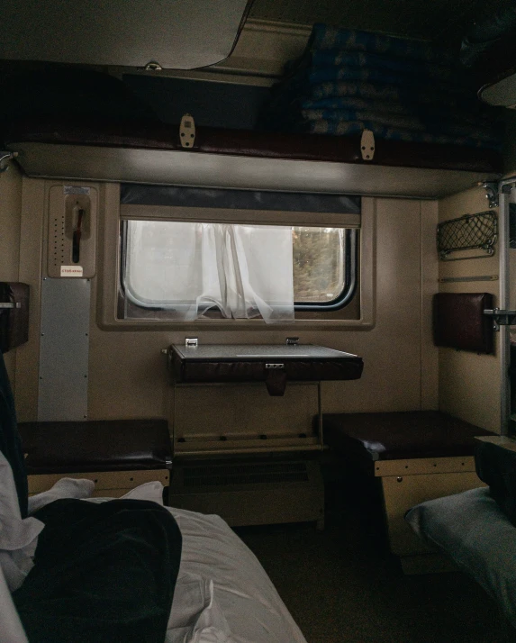a room inside of a train on the tracks