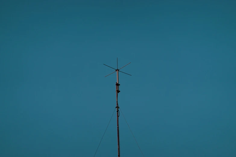 a tv antenna on the top of a small tower