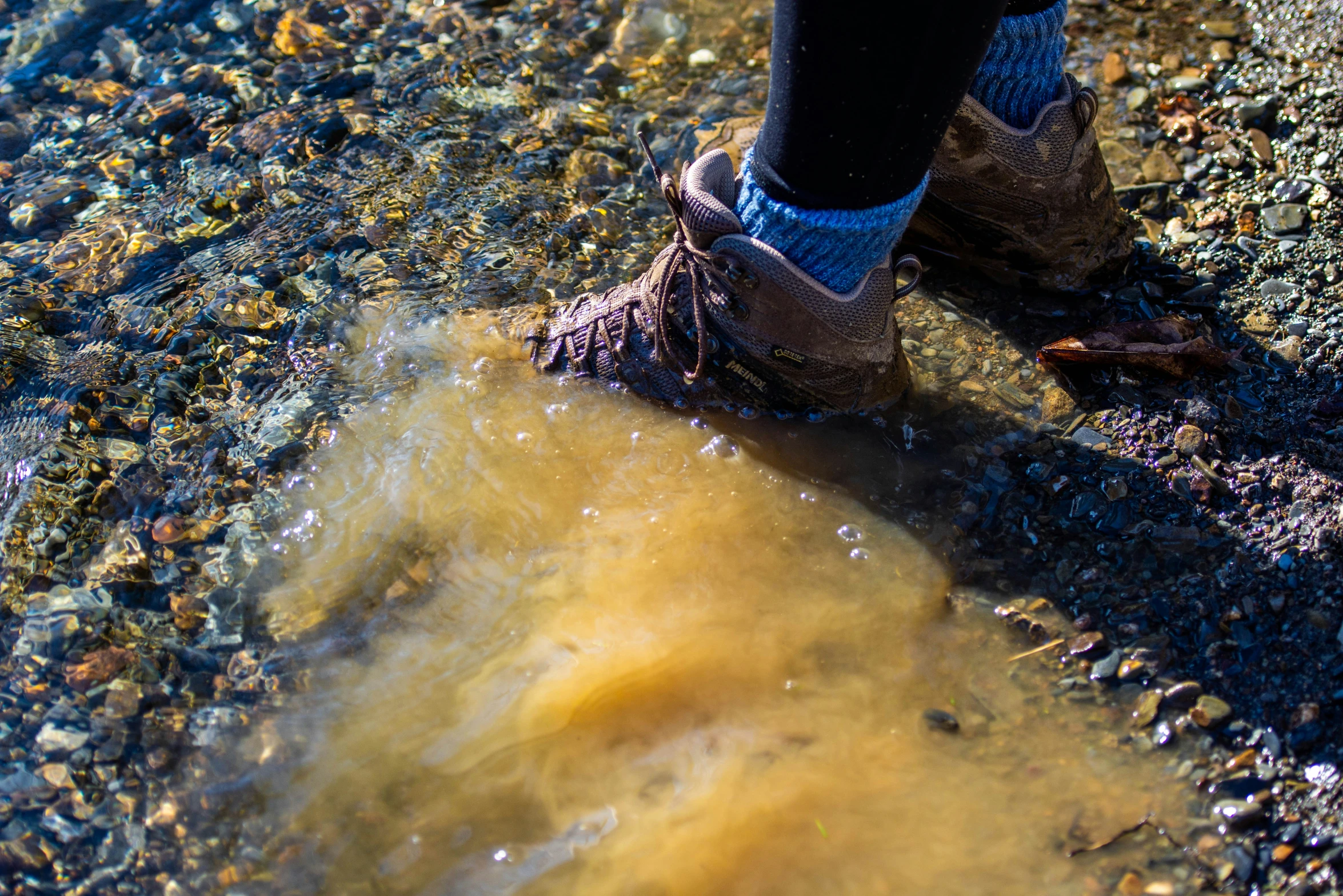 close up view of a persons boots in water