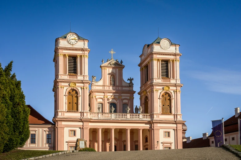 a pink building with two large towers