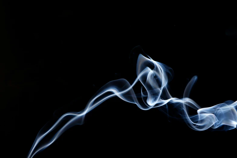 a close up of smoke on a black background