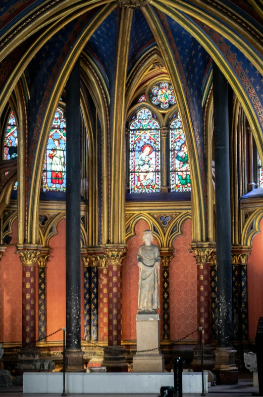 an elaborate interior of a cathedral with stained glass windows