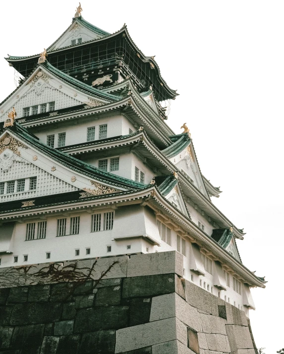 a tall white castle tower with lots of windows