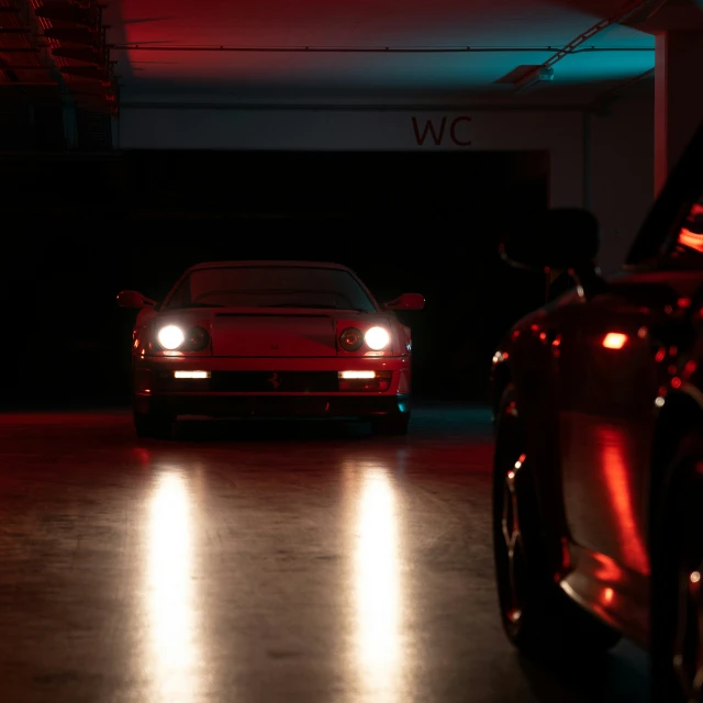 a porsche in the dark with its lights on