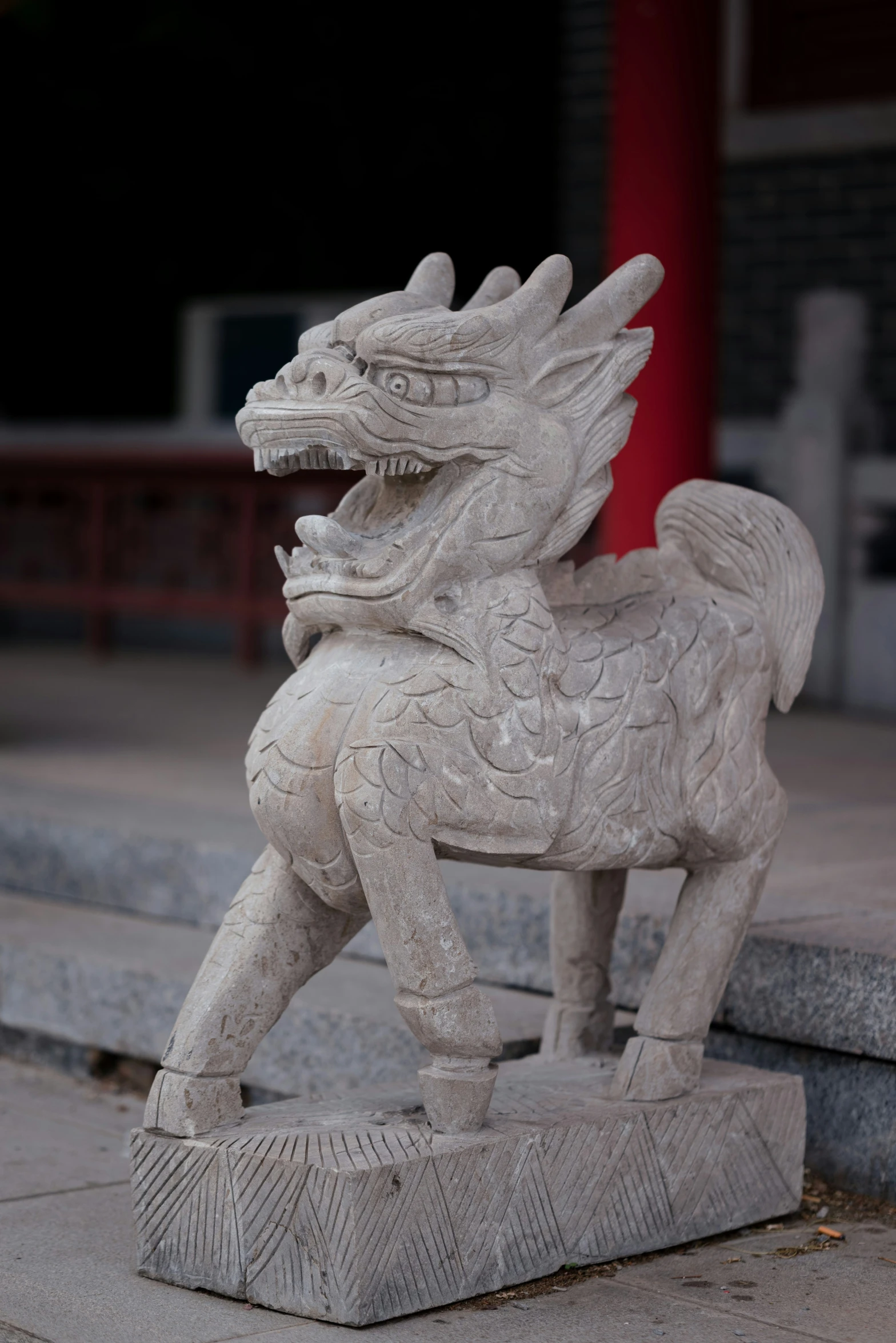 a statue of a dragon on top of stone