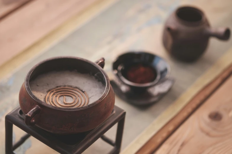 a wooden stand holds two pots on it