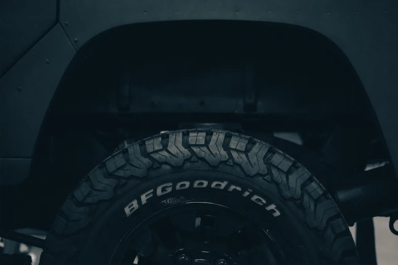 the front of a jeep with the tires and tire rims