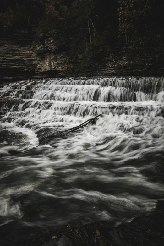 a large water fall with some small rapids in it