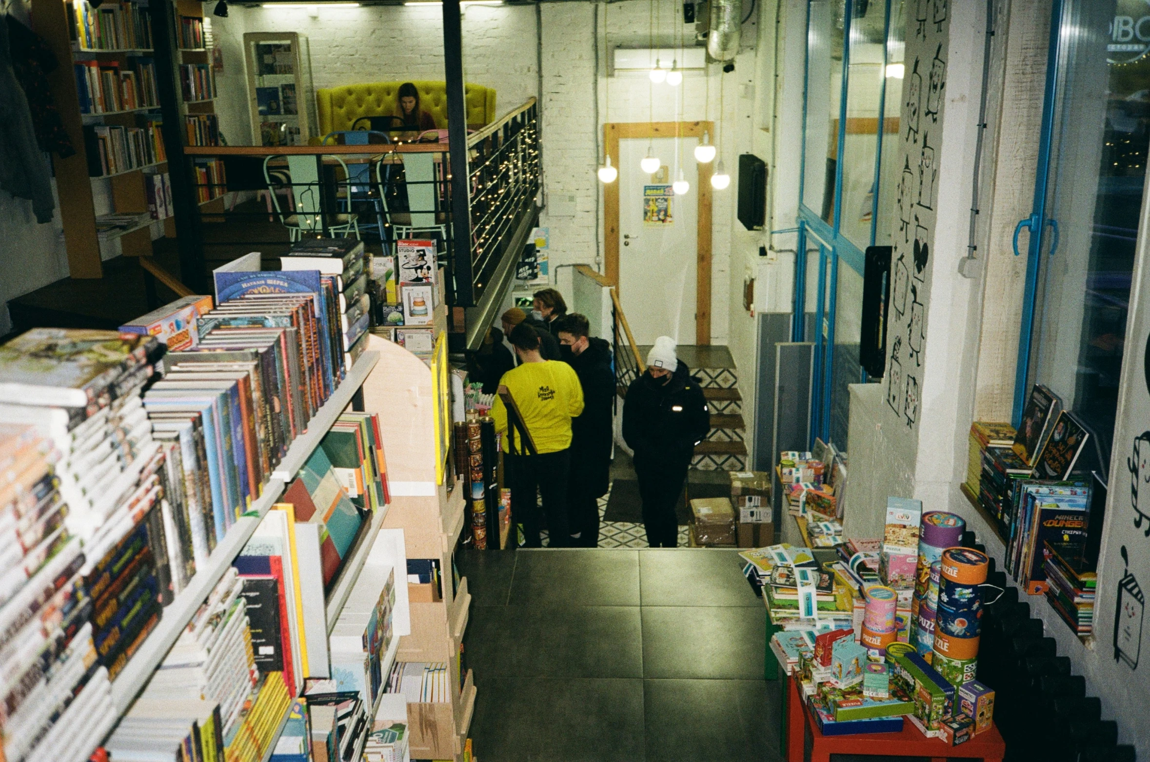 the interior of a liry with stacks of books on display