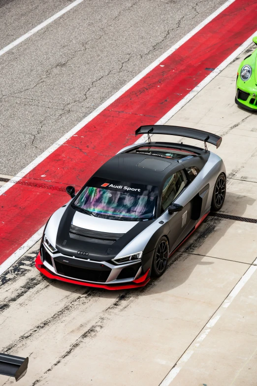 an audi race car is in position to drive