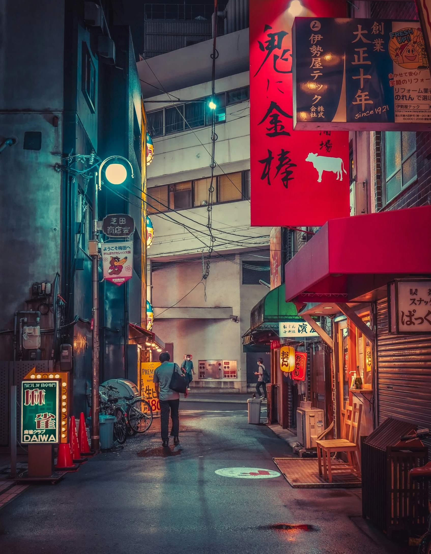 a narrow city street with asian - style signs at night