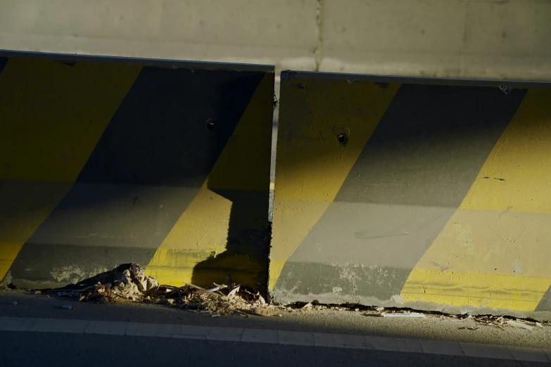 the side of a road with graffiti on it