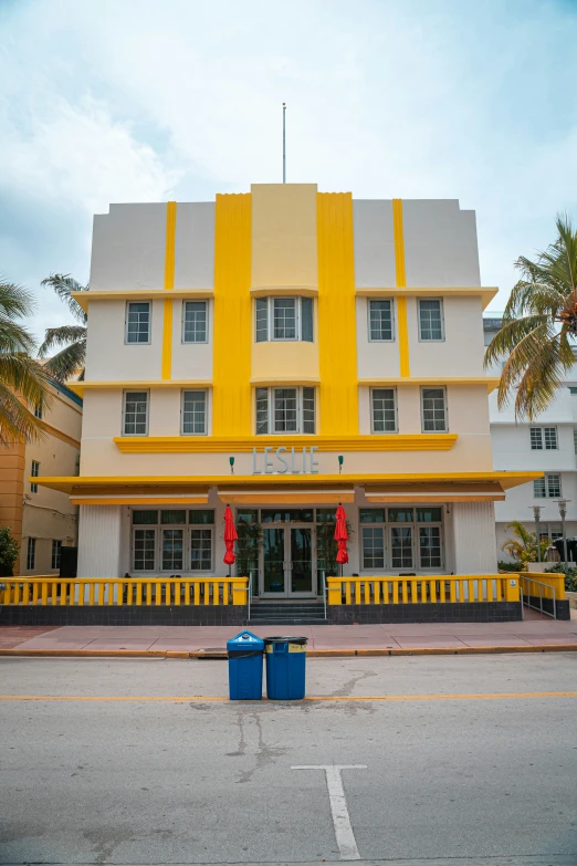 an old building with a yellow stripe in front