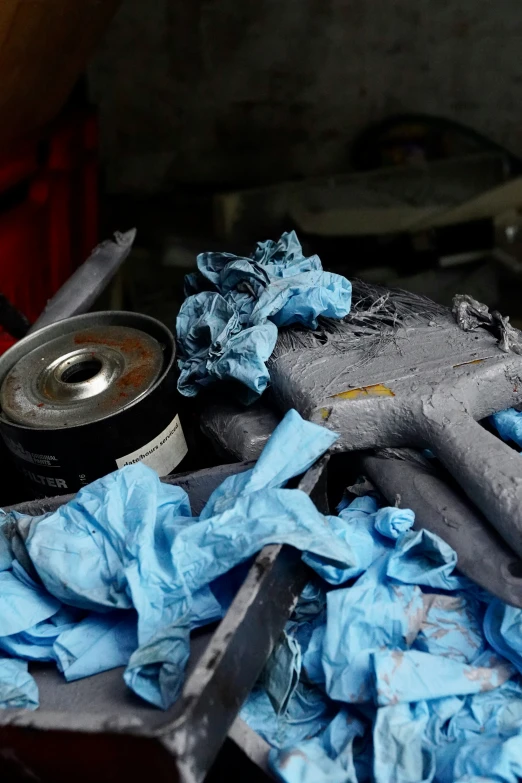 pile of cloth sitting next to a can of soda