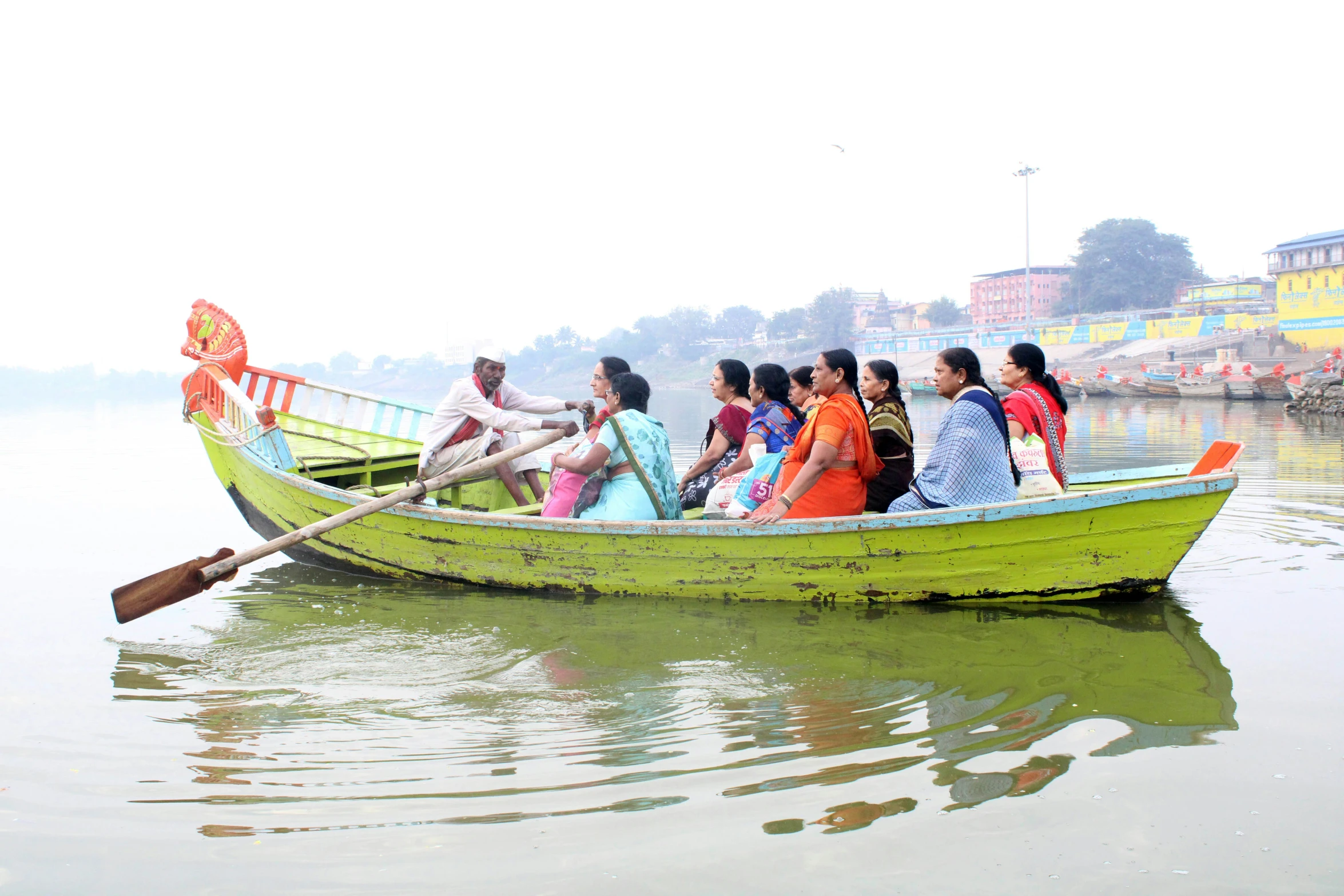 people on a canoe boat are watching the people