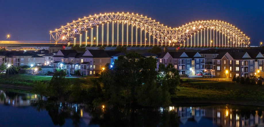 night scene with roller coaster in the distance