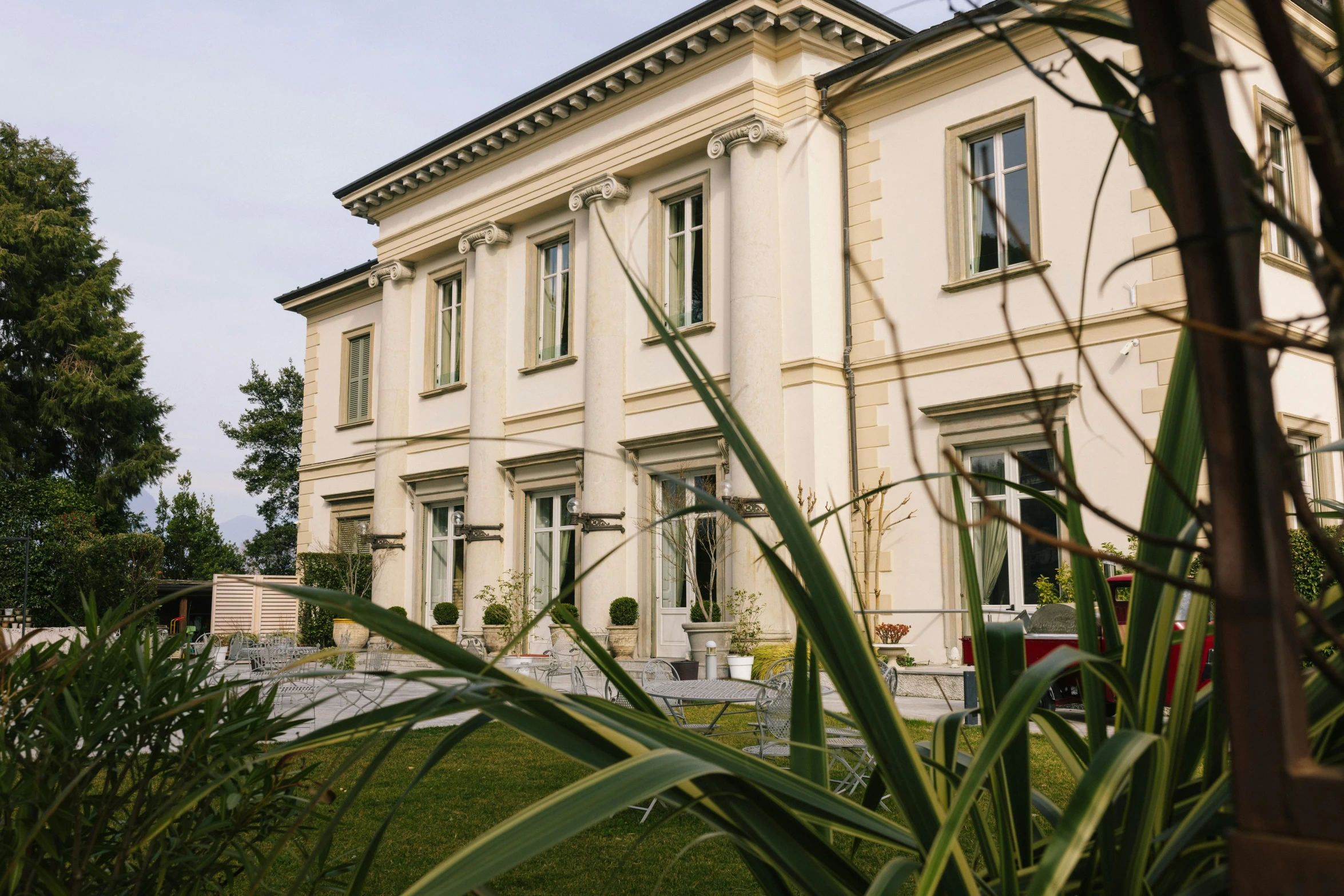 a house with a huge grassy lawn on the outside