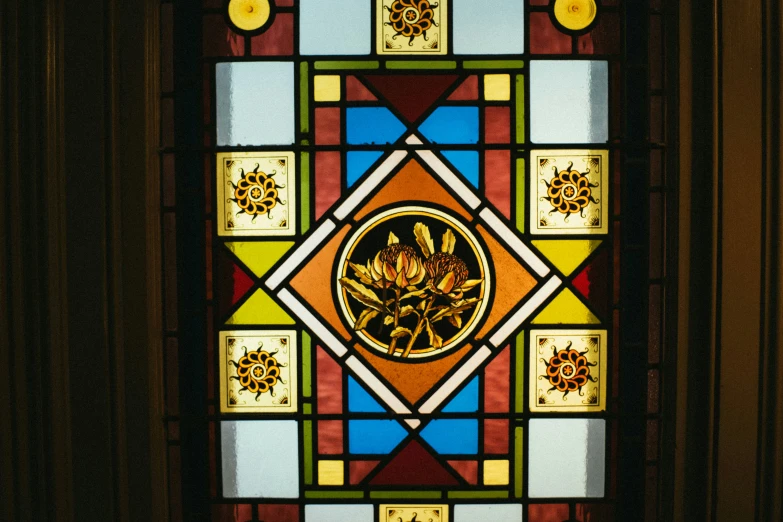 a colorful glass window inside of a building