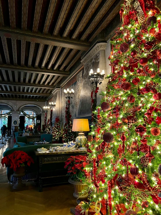 a very decorated christmas tree in a large building