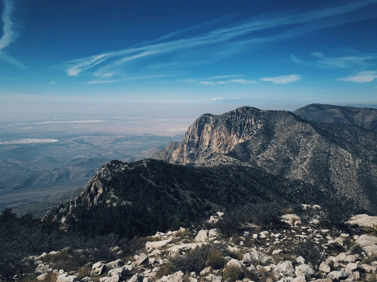 view over the side of a mountains with trees