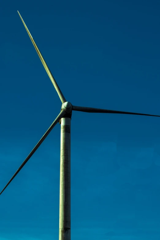 the side of a wind turbine in the sky