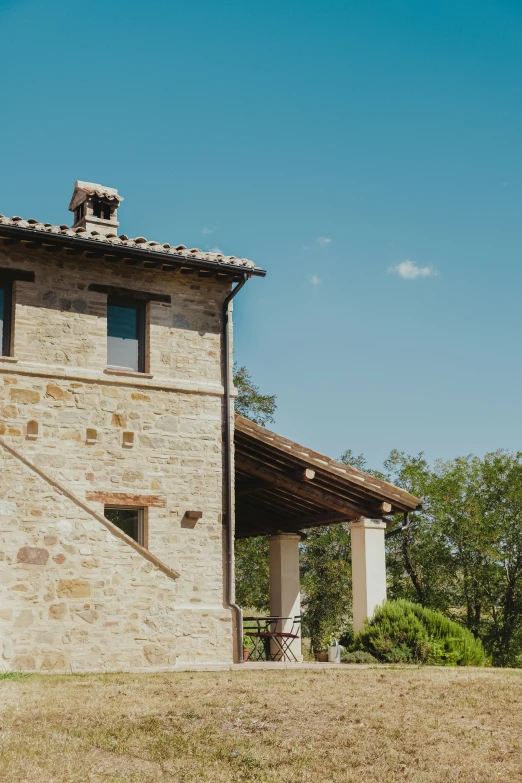 an old stone building with a stone staircase going up the side