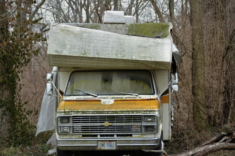 an old truck has a white roof and a green roof