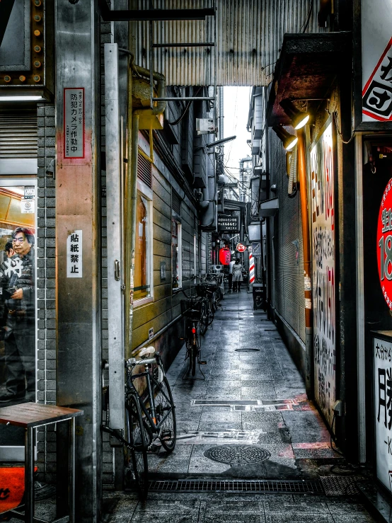 an empty walkway with a few bicycle parked inside it