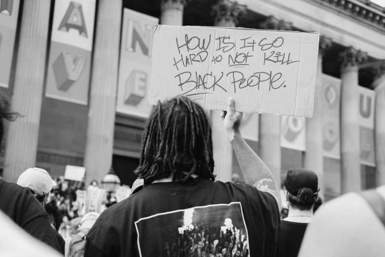 the young men are protesting at a rally