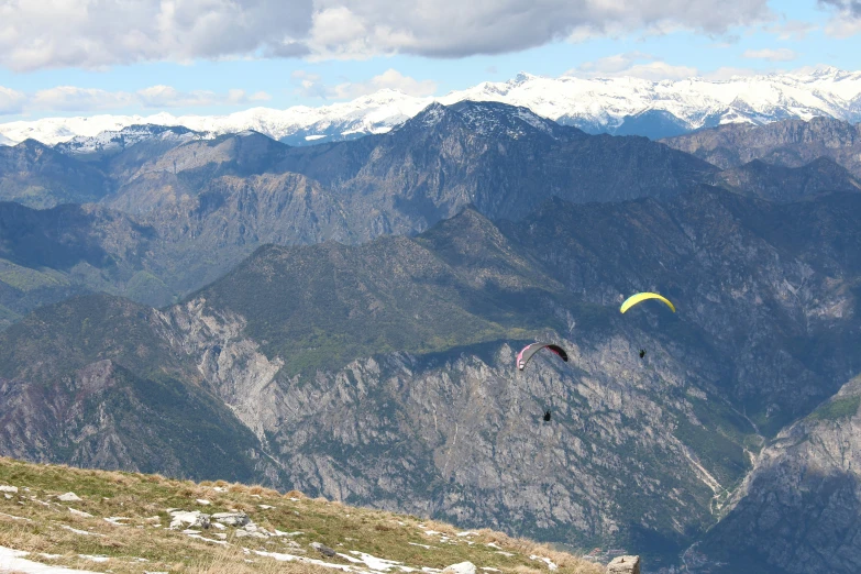 a person on a hill with a kite