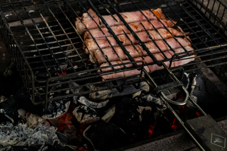 two grilled  dogs sit on a grill