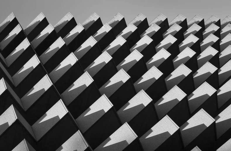 a black and white po of some windows with diagonals