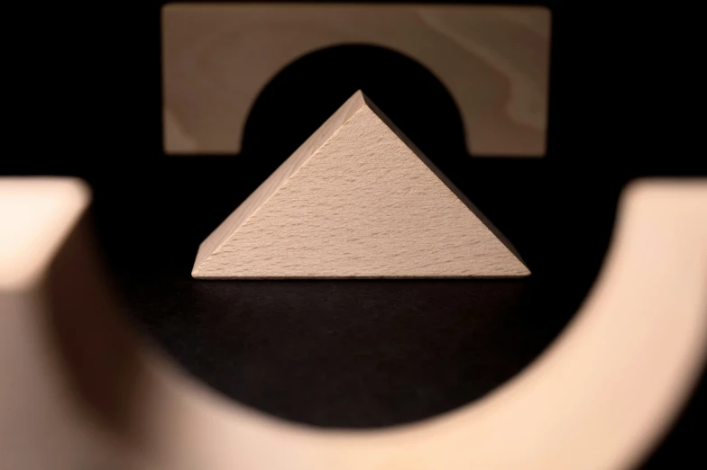 a triangle is seen in front of a square and triangular