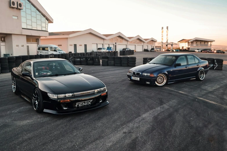 a black car and a black car with chrome rims