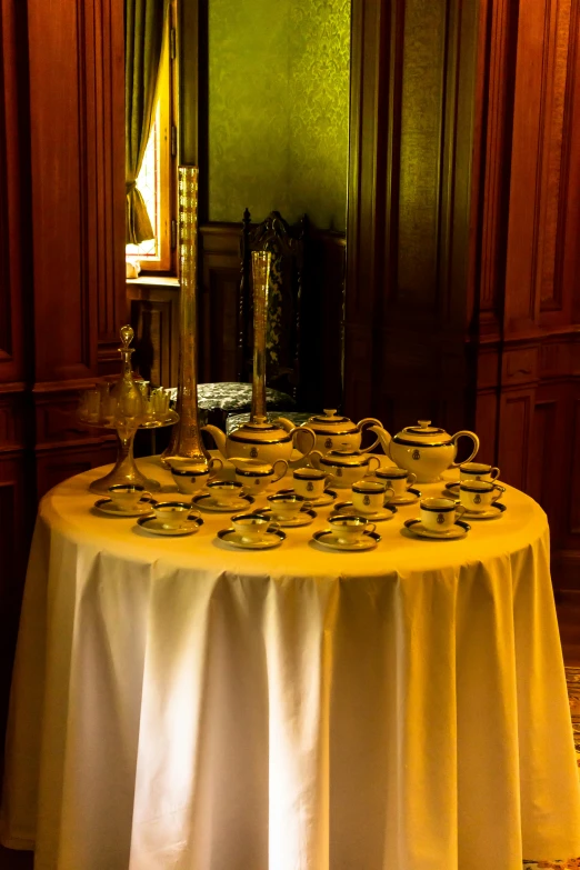 a table with many plates on it in a room