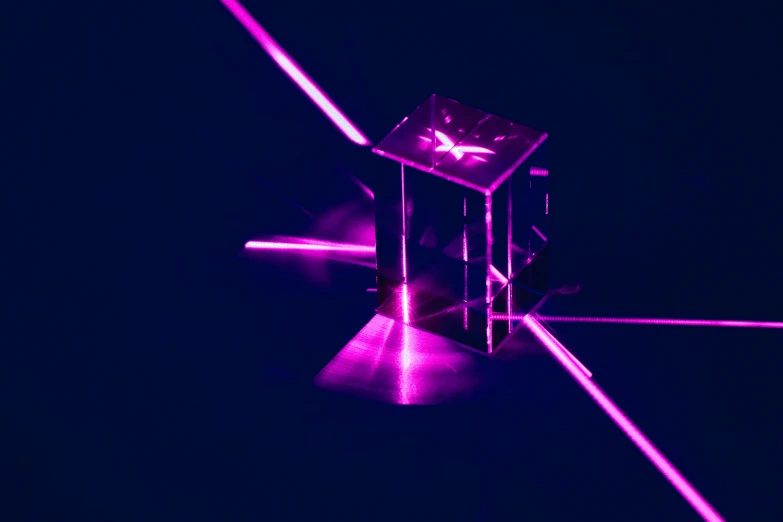 an optical picture of a glass cube and two neon lights