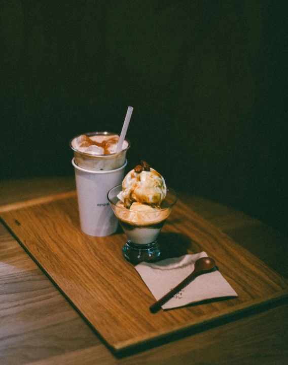 two cups filled with food sitting on top of a wooden table